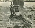 StateLibQld 1 251308 Two young men having fun with their home-made watercraft on the Brisbane River