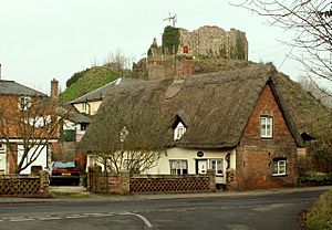 Thatched cottage with Eye Castle behind - geograph.org.uk - 342742