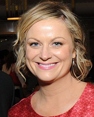 Amy Poehler smiles broadly at the camera