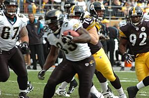 Greg Jones rushes vs Steelers in 2005