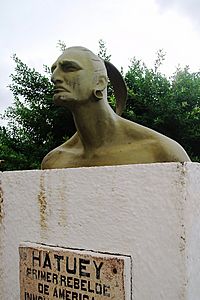 A large stylized bust on concrete