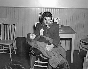 Immigrant Woman with Baby, Pier 21, Halifax, Nova Scotia, Canada, 1948