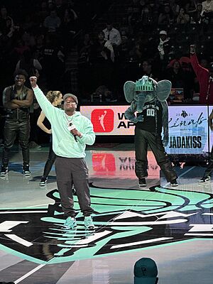 Jadakiss performs at the 2024 WNBA Finals Game 2 Halftime Show. Ellie The Elephant looks on