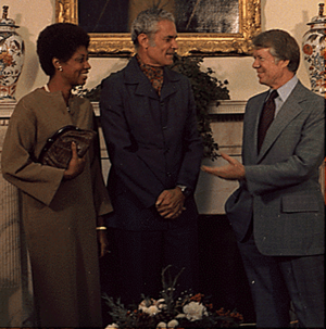 Mrs. Michael Manley, Prime Minister Michael Manley and Jimmy Carter during an Oval Office meeting 1977