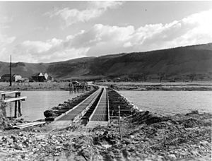 Treadway M2 Bridge built by 1139th across the Saar River at Schoden, Germany March 2, 1945