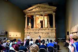 An actor and actress performing a play in front of the Nereid Monument, Room 17, the British Museum, London