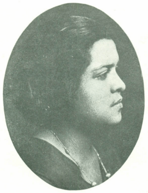 A young Black woman, in profile, in an oval frame