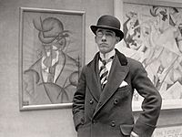 Gino Severini at the opening of his exhibition at the Marlborough Gallery, London, 1913.jpeg