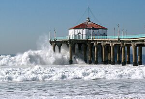 Huge surf strikes the Manhattan Beach Pier during the biggest storm of Winter 2007-2008