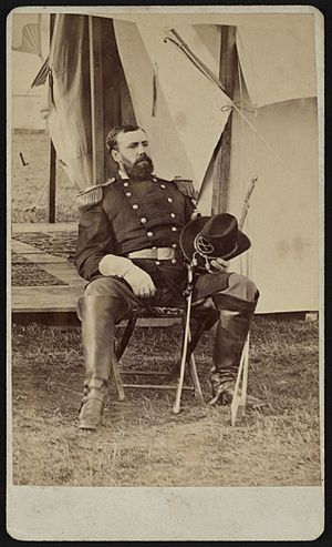 Major General Eugene Asa Carr of General Staff U.S. Volunteers Infantry Regiment, seated by a camp tent in uniform with sword LCCN2017659683
