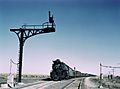 West bound Santa Fe RR freight train waiting in a siding to meet an east bound train, Ricardo, New Mexico