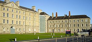 Facade of the former Collins Barracks with museum signage in the foreground.