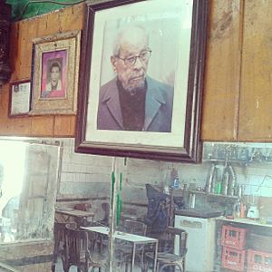 Photo of Naguib Mahfouz hanged on Kirsha's café wall which was mentioned in his Midaq Alley novel