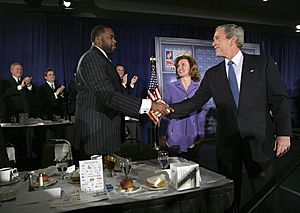 President George W. Bush greets Detroit Mayor Kwame Kilpatrick