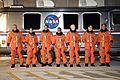 STS-128 crew members alongside the Astrovan