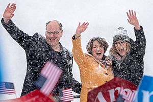Amy Klobuchar with her husband John and daughter Abigail at her side, waves to the crowd after announcing her bid for the presidency at Boom Island Park in Minneapolis, Minnesota (46330801274)
