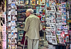 An old man in newsagent's shop, Paris September 2011