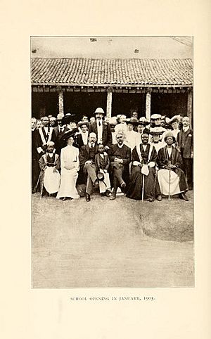 George Wilson in the front with his British wife at the right of him at the official opening of Mengo high school in 1905
