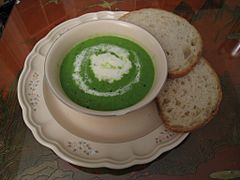 Spring pea soup with crème fraîche and bread