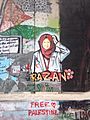 Bethlehem wall graffiti Razan with flower