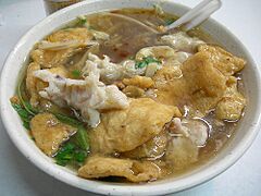 Chinese-style geng with meat, fish cakes, and squid