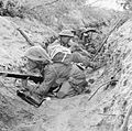 Men of 'D' Company, 1st Battalion, The Green Howards occupy a captured German communications trench during the offensive at Anzio, Italy, 22 May 1944. NA15297