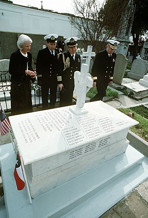 RADM Theodore C. Lockhart, left, commander, South Atlantic Force, is joined by two Chilean naval officers and an unidentified woman as he pays his respects at a marker dedicated to - DPLA - 5397eb3592b92445fb6be7b675e0efb3