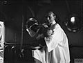 BABY CHRISTENED ON BOARD SHIP. 2 JULY 1943, HARWICH. BABY SHIELA CONSTANCE MCDOUGALL WAS BAPTISED ON BOARD HM TRAWLER SAPPHIRE. THE CEREMONY WAS PERFORMED BY THE SHIP'S CHAPLAIN WHO USED THE SHIP'S BELL AS A FO A18220