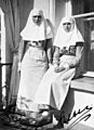 Grand Duchesses Olga and Tatiana Nikolaevna of Russia as nurses, signed