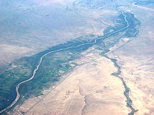 Rio Grande and Interstate 25 passing through Bernardo and Contreras, New Mexico. View from the northwest. Rio Puerco flowing toward the Rio Grande from the west.