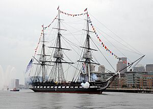 USS Constitution fires a 17-gun salute