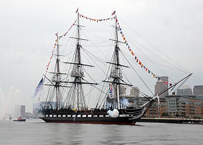 USS Constitution fires a 17-gun salute