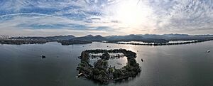 Aerial panorama of West Lake and its surrounding mountains. December 2023