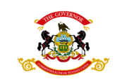 The flag of the governor of Pennsylvania contains the state coat of arms on a field of white. Above the coat of arms, the flag displays a red ribbon with "The Governor" written in gold sans serif lettering. Below the coat of arms, the flag displays another red ribbon with "Commonwealth of Pennsylvania" in gold lettering.