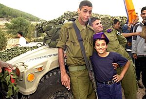 Flickr - Israel Defense Forces - Bedouin Soldier with Schoolchild