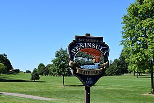 Peninsula State Park sign at the golf course