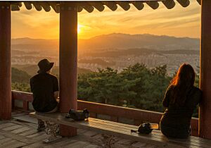 Two people viewing sunset from Bomunsan (mountain) Fortress in Daejeon, Korea