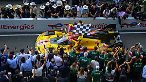 24H Le Mans 2025 winning car with the chequered flag