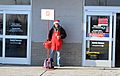 Salvation Army red kettle at supermarket entrance Ypsilanti Michigan