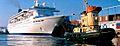 Tour boat Theodore Too escorts cruise ship Norwegian Sea docking at Halifax Harbour in 2003