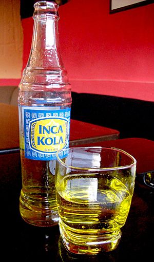 Bottle and glass of inca kola