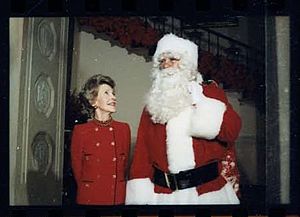 John Riggins as Santa and Nancy Reagan unveil Christmas decorations at White House 1984, photo 15