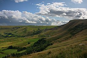 A view of grass-covered hillside located within a British National Park.