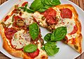 Pepperoni pizza with basil