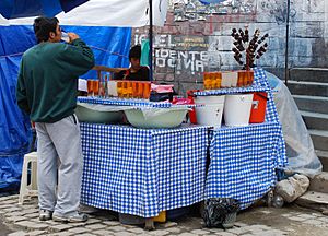 Drinking mocochinchi in market in La Paz