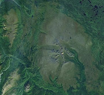 A satellite view of two large mountains near the crest of a mountain range to the southwest.
