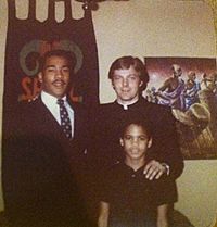 Photograph- A young Fr. Pfleger with Dexter Scott King, and Pfleger's son Lamar. (14563086987)