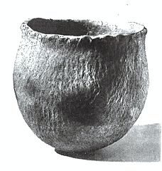 Pottery vessel with exterior lip impressed rim