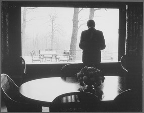 Richard M. Nixon standing in front of a window inside the Camp David lodge. - NARA - 194468