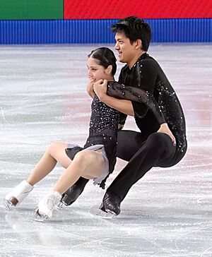 Riku Miura and Ryuichi Kihara performing a cantilever during their short program at the 2024-25 Grand Prix Final